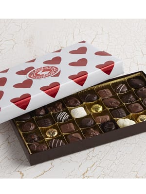 chocolate assortment with valentine's day gift wrapping paper.
